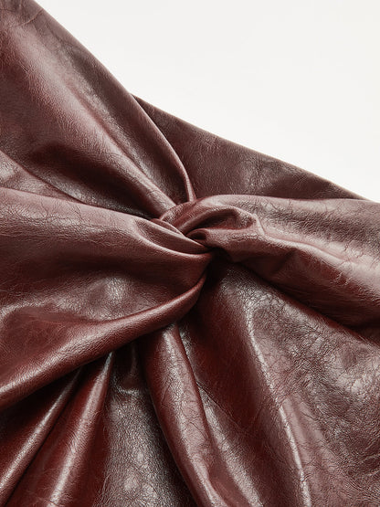 Düğüm Detaylı Yırtmaçlı Suni Deri Midi Etek